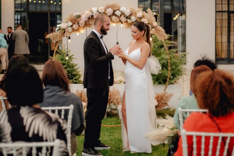 Bride and groom exchange vows in a picturesque outdoor setting. Perfect moment captured.